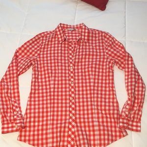 Orange and white gingham shirt.